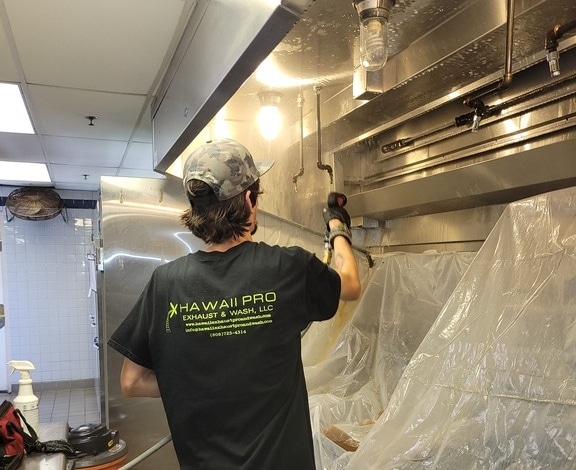 Oahu exhaust hood cleaning being performed in Honolulu. Kitchen exhaust hood cleaning services are provided by professional companies to perform the maintenance required in Hawaii.